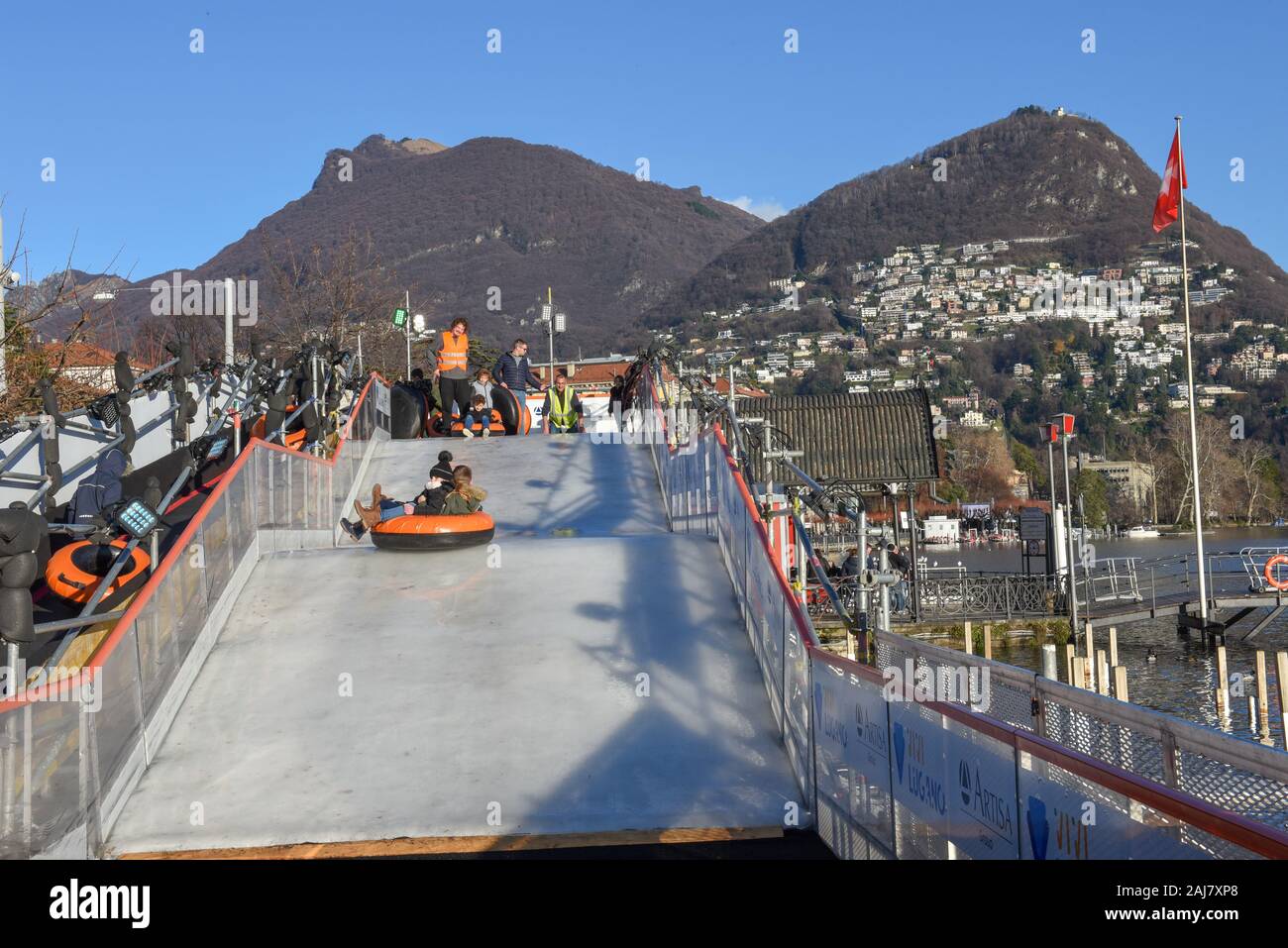 Lugano, Switzerland - 10 July 2016 - children who practice ice tubing at Lugano on Switzerland Stock Photo