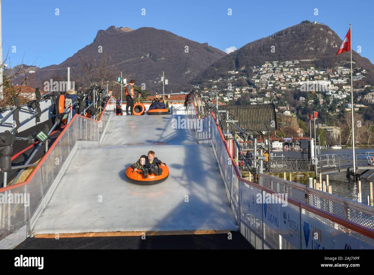 Lugano, Switzerland - 10 July 2016 - children who practice ice tubing at Lugano on Switzerland Stock Photo