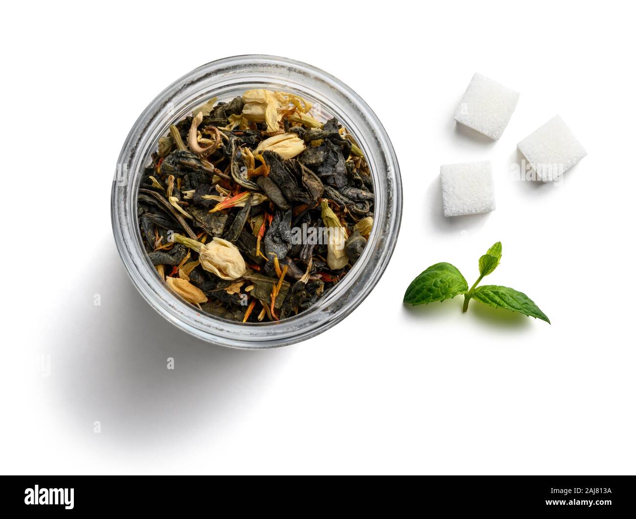Green tea with natural aromatic additives and sugar. Top view on white ...