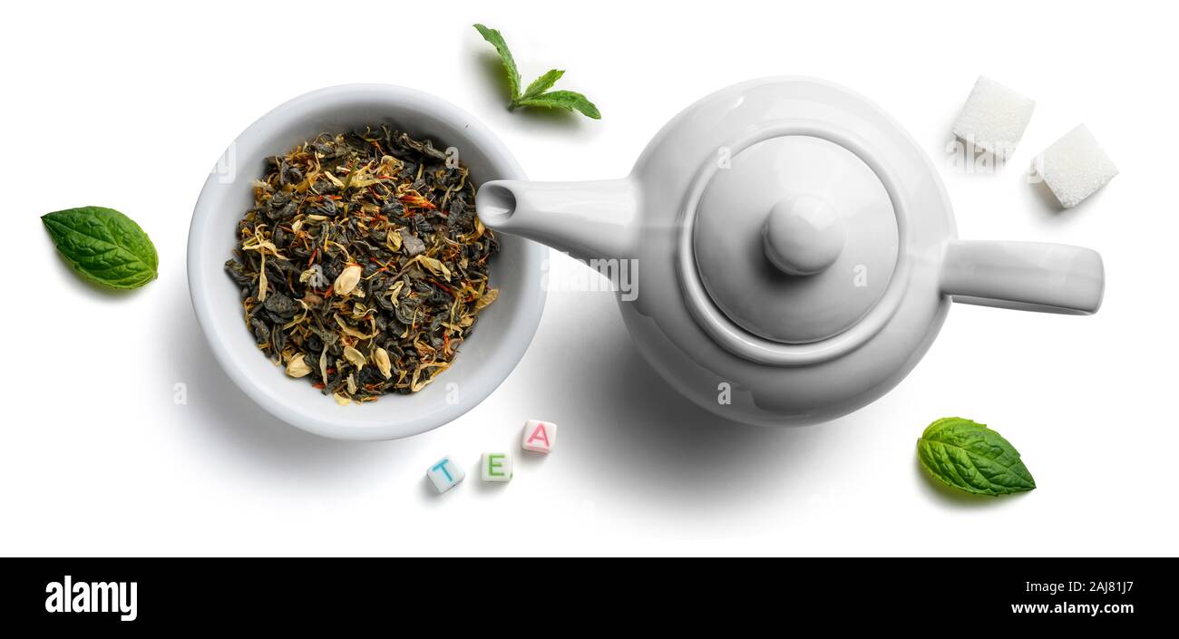 Green tea with natural aromatic additives and a teapot. Top view on ...
