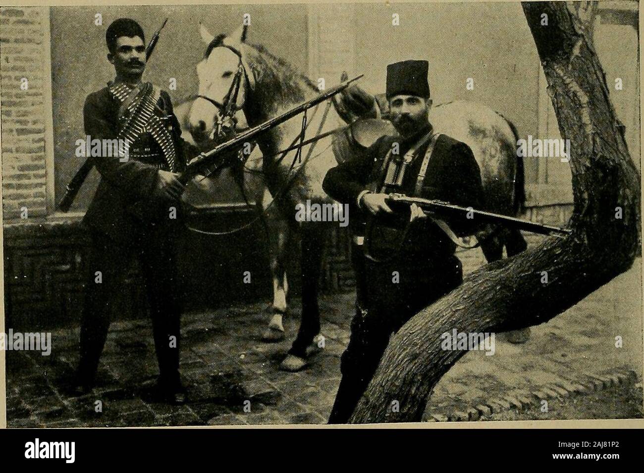 The strangling of Persia; a story of the European diplomacy and oriental intrigue that resulted in the denationalization of twelve million Mohammedans, a personal narrative . FPHRIM KHAN (WITH FUR-COLLARED OVERCOAT), AMIR MUJAHID (LEANING^^ ON CANE) AND MR. SHUSTER. Inspecting the Nationalist forces about to be dispatched against Muhammad Ali.. EPHRAIM KHAN. With his private bodyguard and favorite horse. THE DIPLOMATIC FIELD IN 1911 257 A railway will be constructed by German concessionaires fromBagad to Khanikin, on the Persian frontier, to connect the Bag-dad line with the Russo-German line Stock Photo