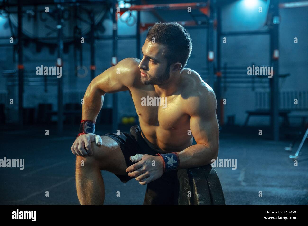 Caucasian man practicing in weightlifting in gym. Caucasian male ...
