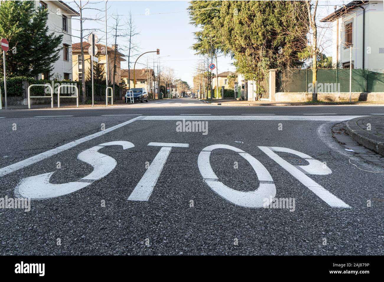 the stop painted on the road surface Stock Photo