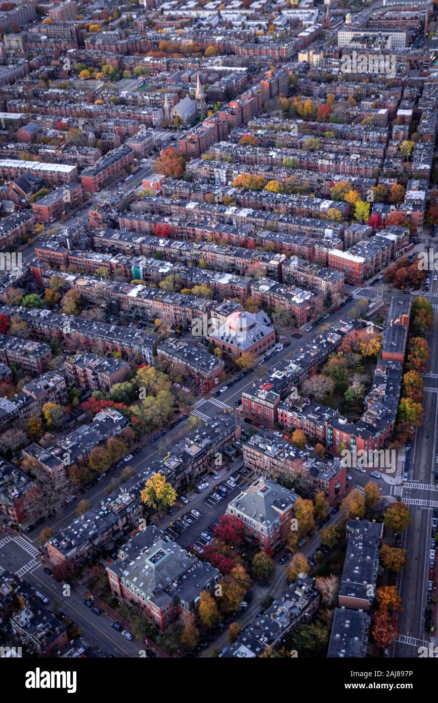 Boston aerial views from helicopter during peak foliage at sunrise