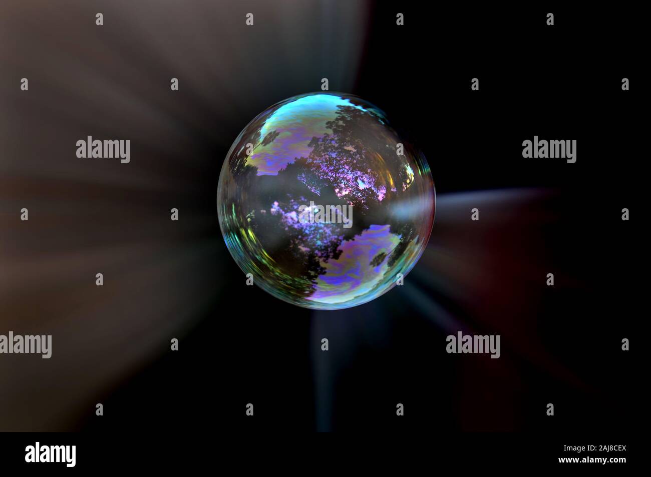 Soap buble black rays background Stock Photo - Alamy