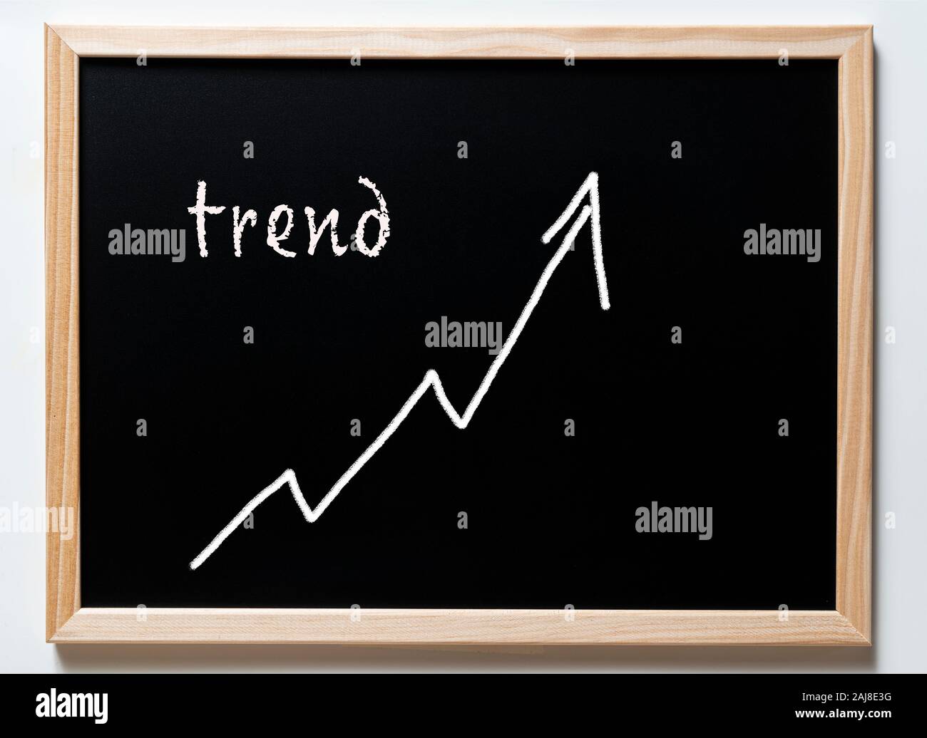 a blackboard with written  the word trend Stock Photo