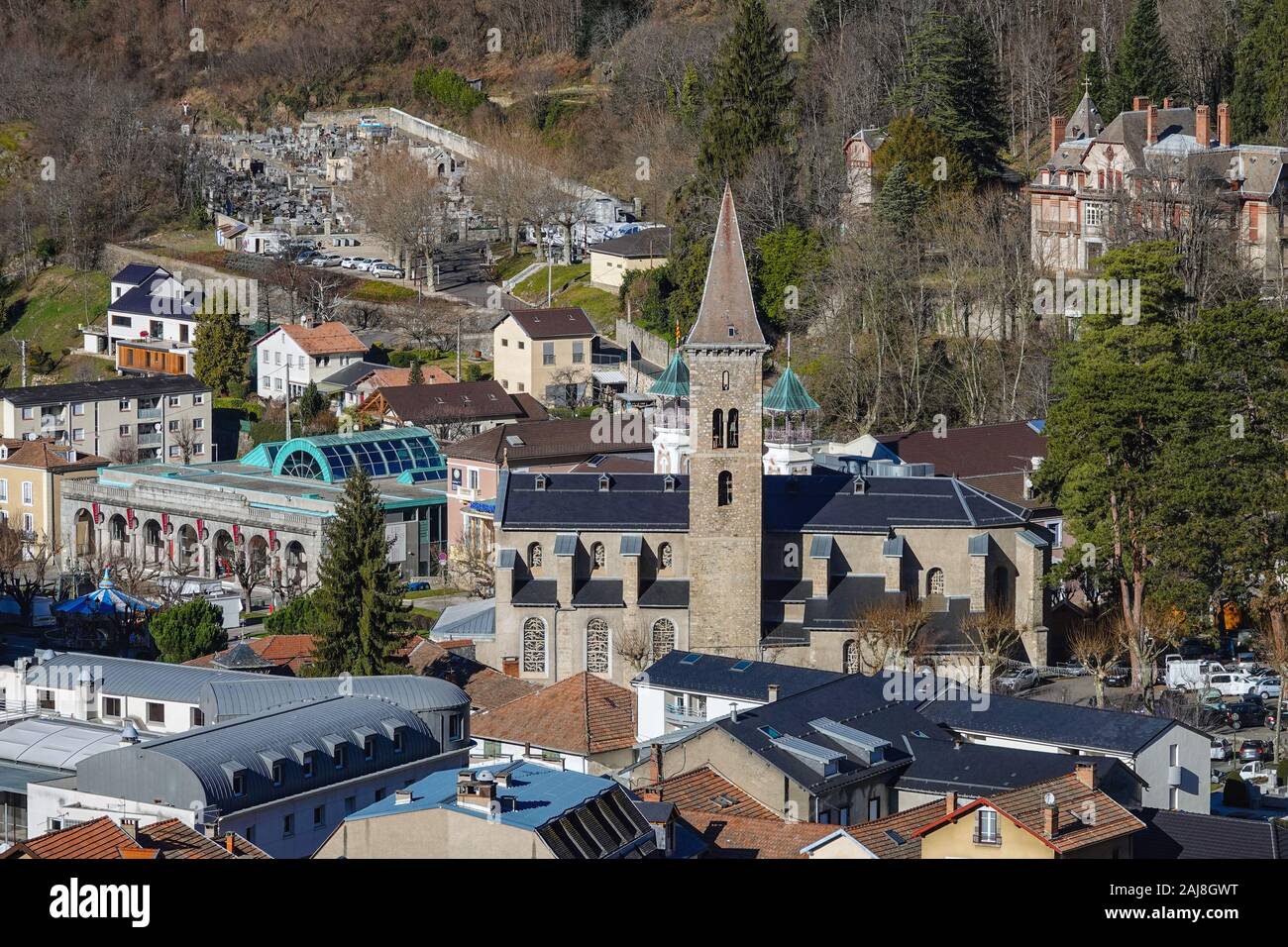 Church and spa, rooftops and buildings at Ax-les-Thermes, Ariege, French Pyrenees, France Stock Photo