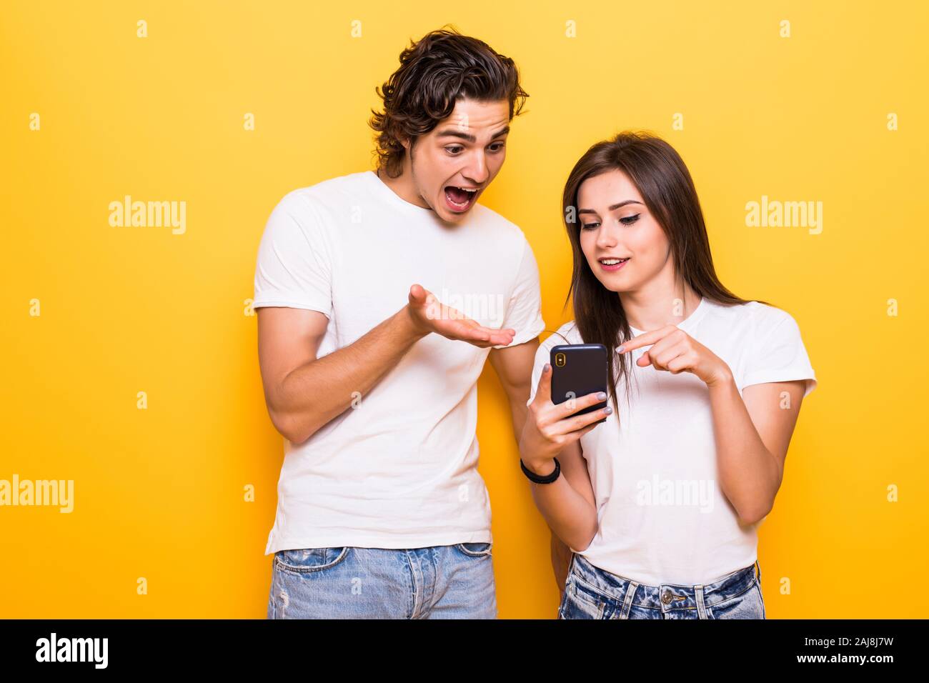 Photo of positive excited people man and woman screaming and looking at ...