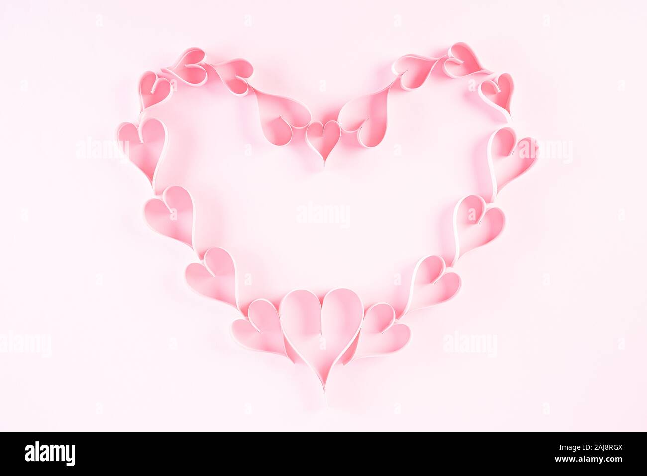 Small Pink Paper Hearts In Shape Of Heart On Light Pink Pastel