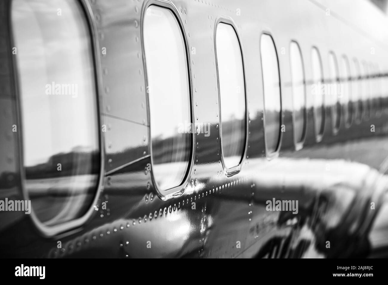 Close up on the fuselage of the commercial airplane, jetliner body casing. Stock Photo