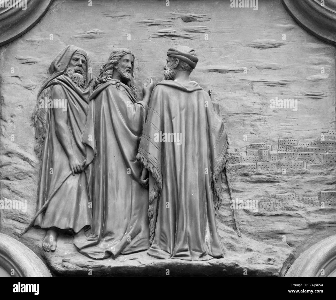 ACIREALE, ITALY - APRIL 11, 2018: Bronze relief of Jesus and the apostles over the Jerusalem from the gate of Basilica Collegiata di San Sebastiano. Stock Photo