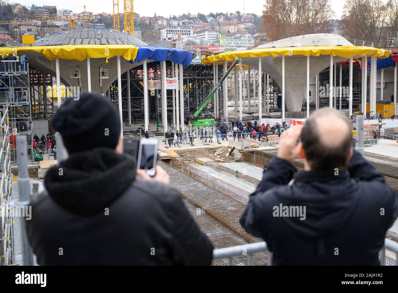 Stuttgart, Germany. 03rd Jan, 2020. Two visitors take pictures of the ...