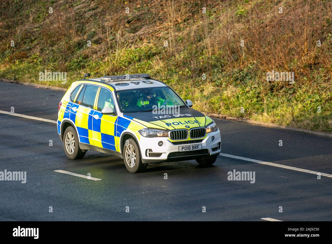 Tac ops, BMW X5 Xdrive30D AC Auto Police car.  Lancashire Tactical Operations division. UK Police Vehicular traffic, transport, modern, BMW saloon cars, east bound on the 3 lane M55 motorway highway. Stock Photo