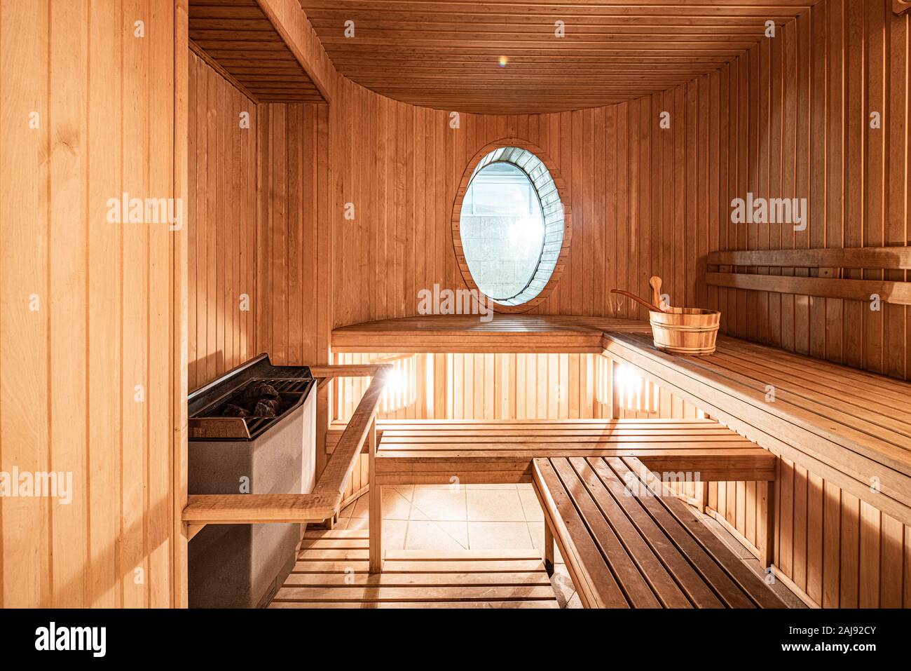 Interior of home hot Finnish wooden sauna. Window. Relaxation Stock Photo -  Alamy