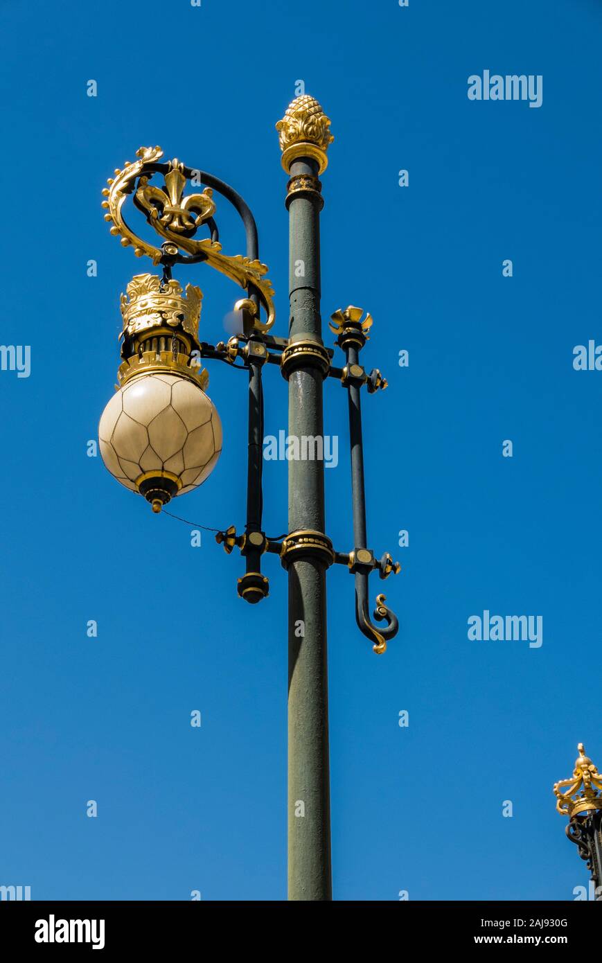 Lamppost outside the railings of the Royal Palace, Madrid, Spain Stock Photo