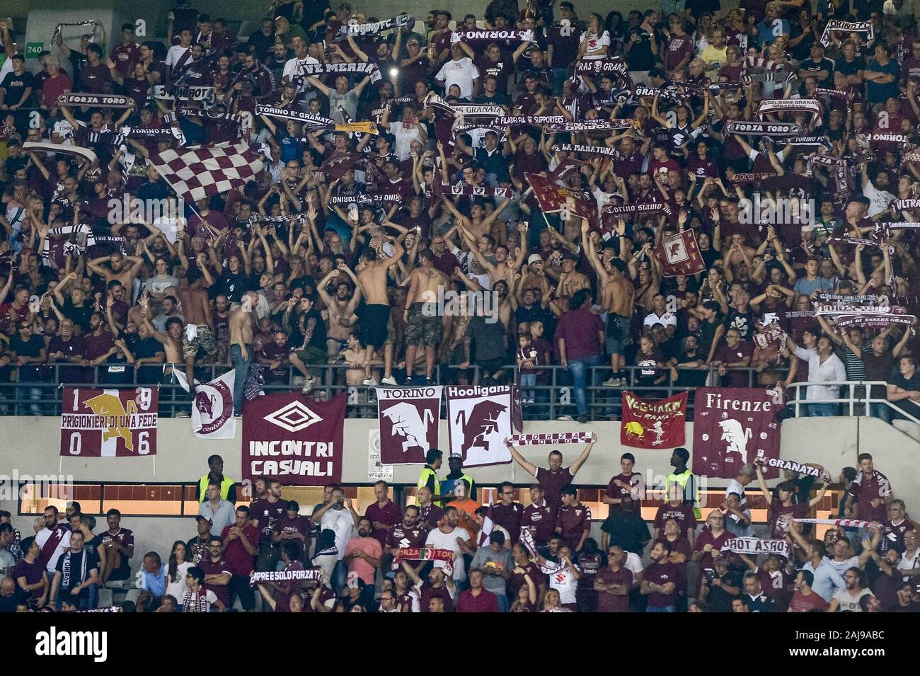 Turin, Italy. 22 August, 2019: Torino fans in sector 'Curva Primavera' show their support behind the banner 'Torino Hooligans' during the UEFA Europa League playoff football match between Torino FC and Wolverhampton Wanderers FC. . On 11 december 2019, 75 ultras belonging to the 'Torino Hooligans' group received DASPO (ban on access to sporting events to prevent violence at stadiums) and 71 were reported for violent crimes. Credit: Nicolò Campo/Alamy Live News Stock Photo