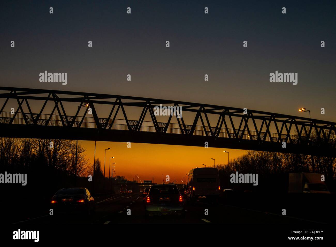 Congested traffic on the M5 motorway at Bristol, England, as night falls, sunset, sundown December 2019 Stock Photo