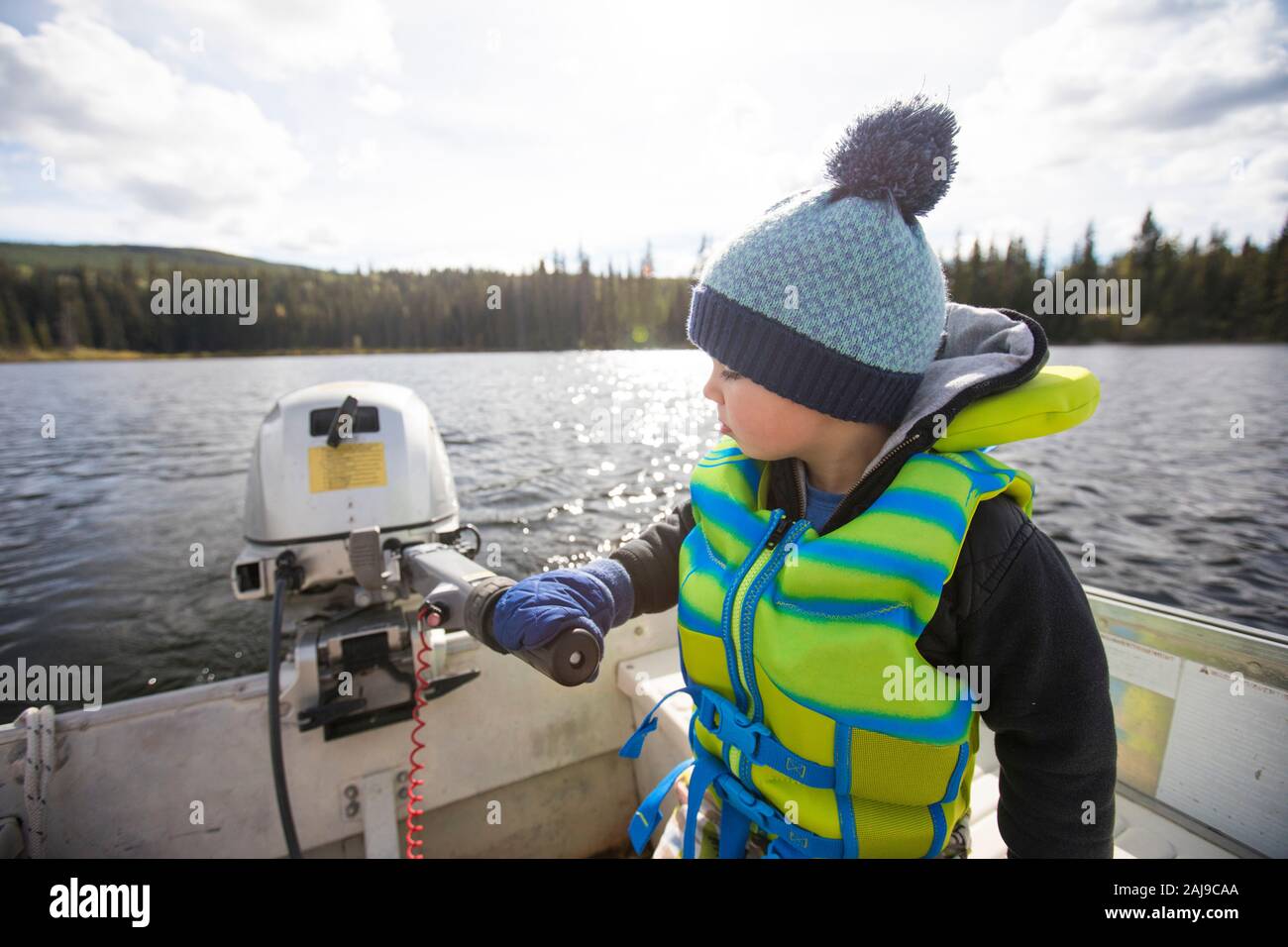 Boy Driving Boat High Resolution Stock Photography and Images - Alamy