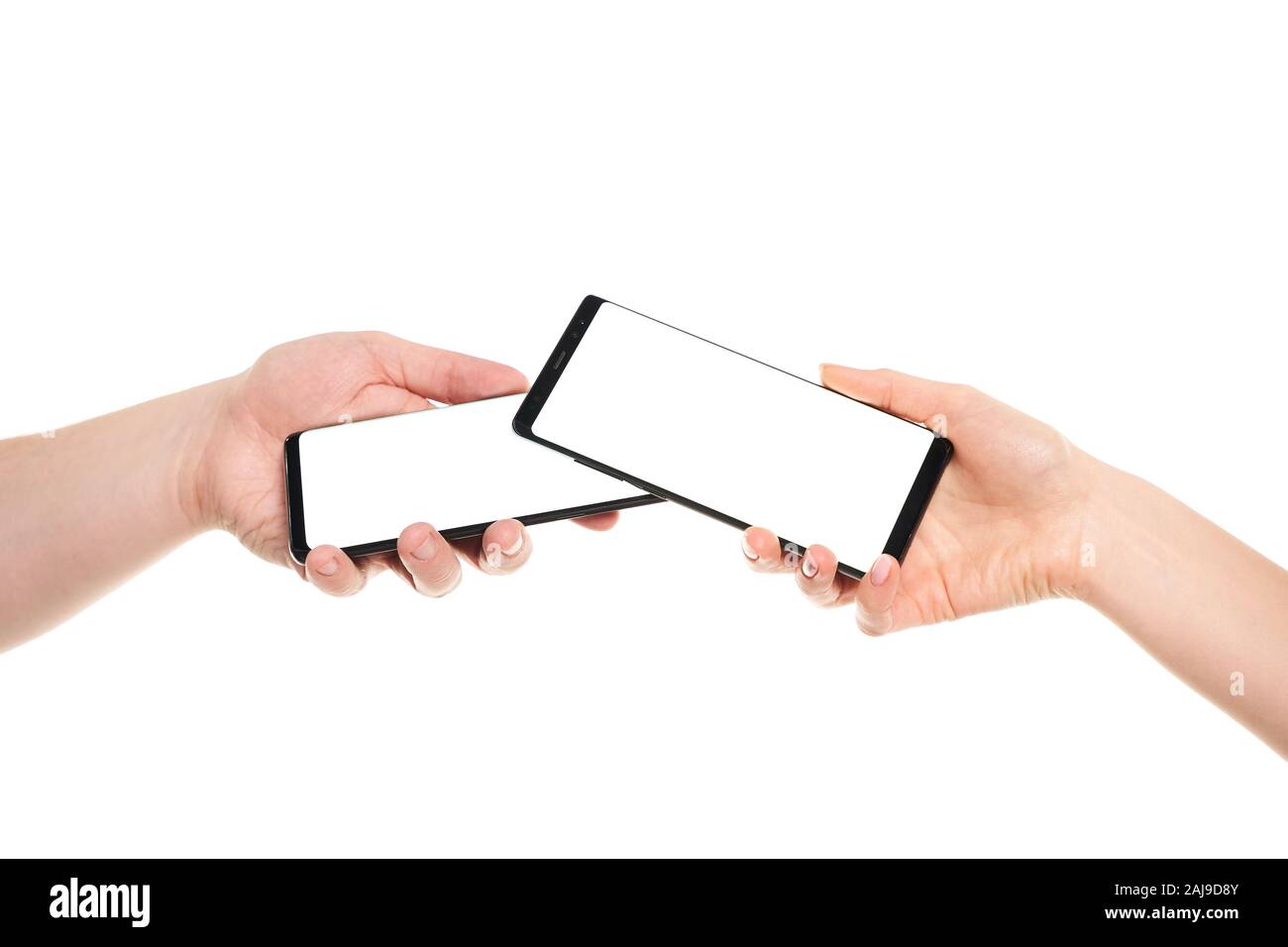 Two hands holding smartphones blank screen with modern frameless design ...