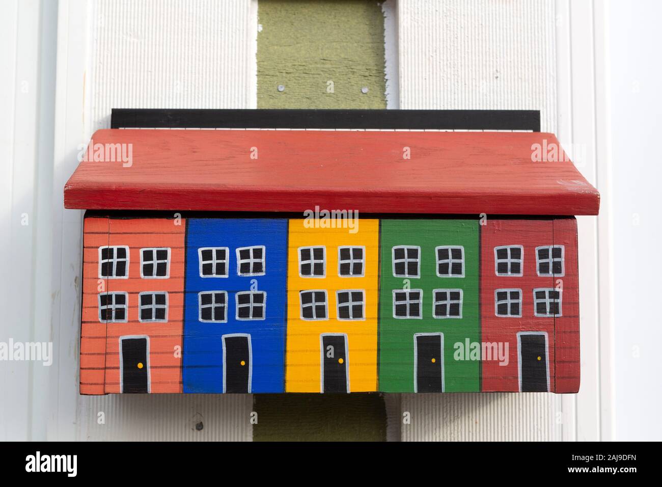 Colourful mailbox in St John's, Newfoundland and Labrador, Canada. It depicts the colourfully painted houses on Gower Street. Stock Photo
