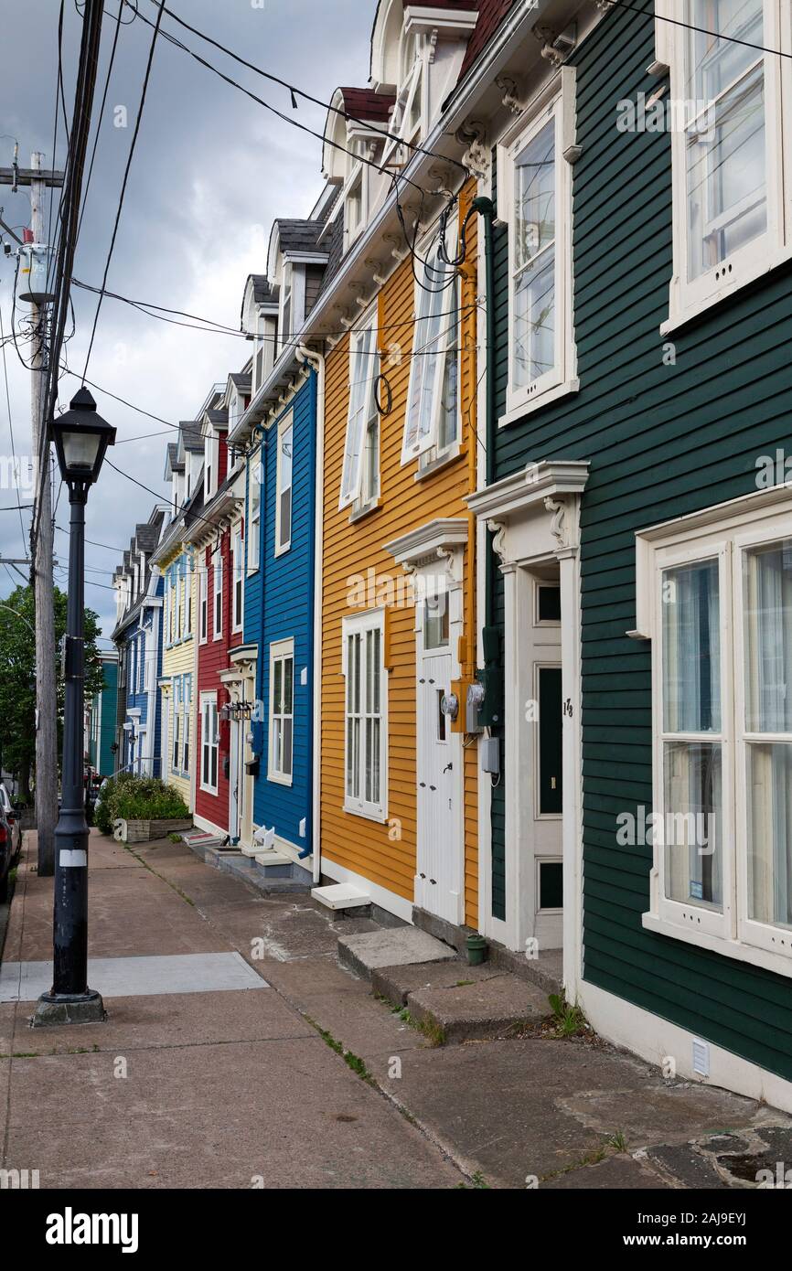 Facades of houses in St John's, Newfoundland and Labrador, Canada. The streetlamp stands on the sidewalk. Stock Photo