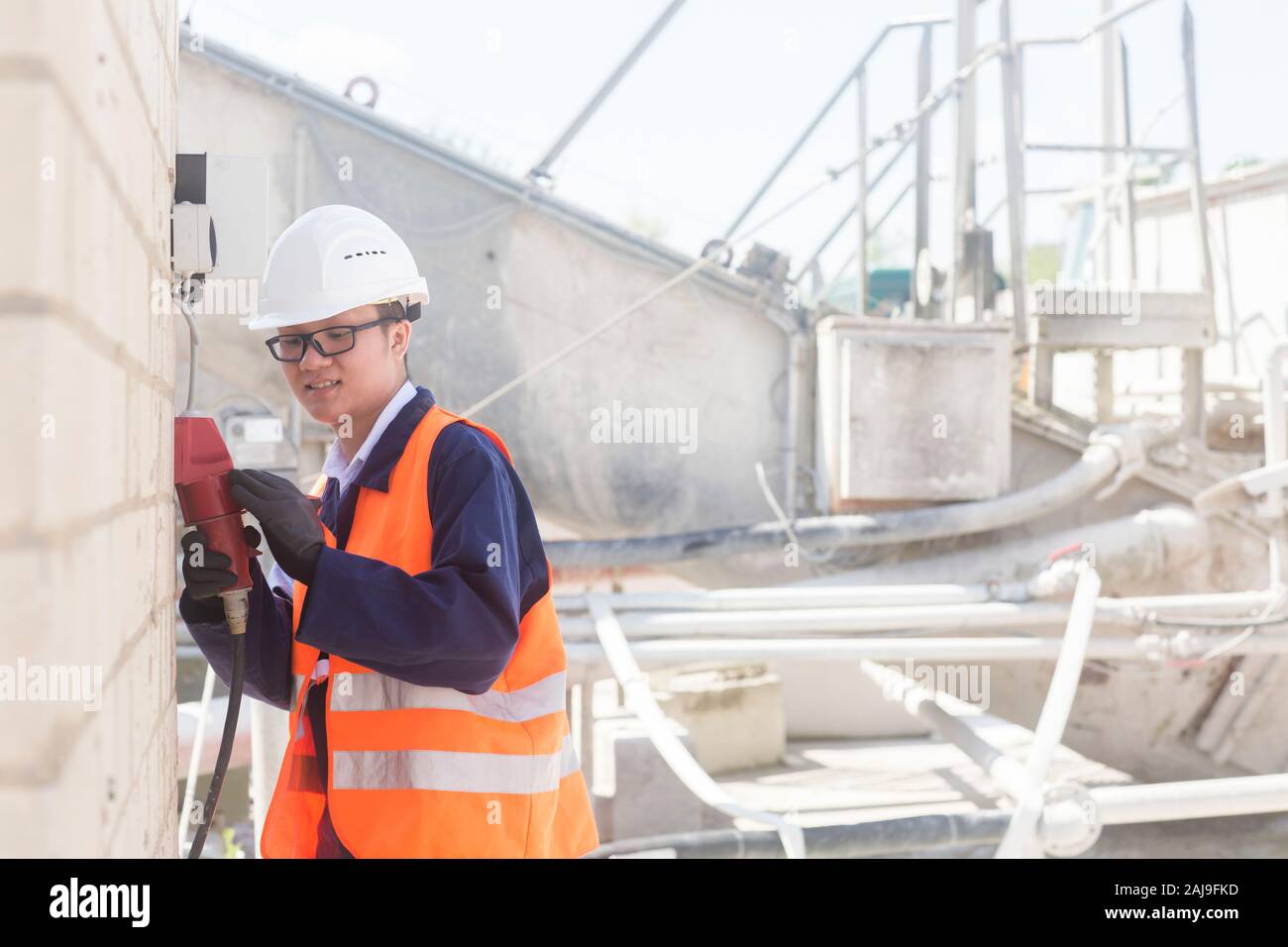 concrete worker checking current outside Stock Photo - Alamy