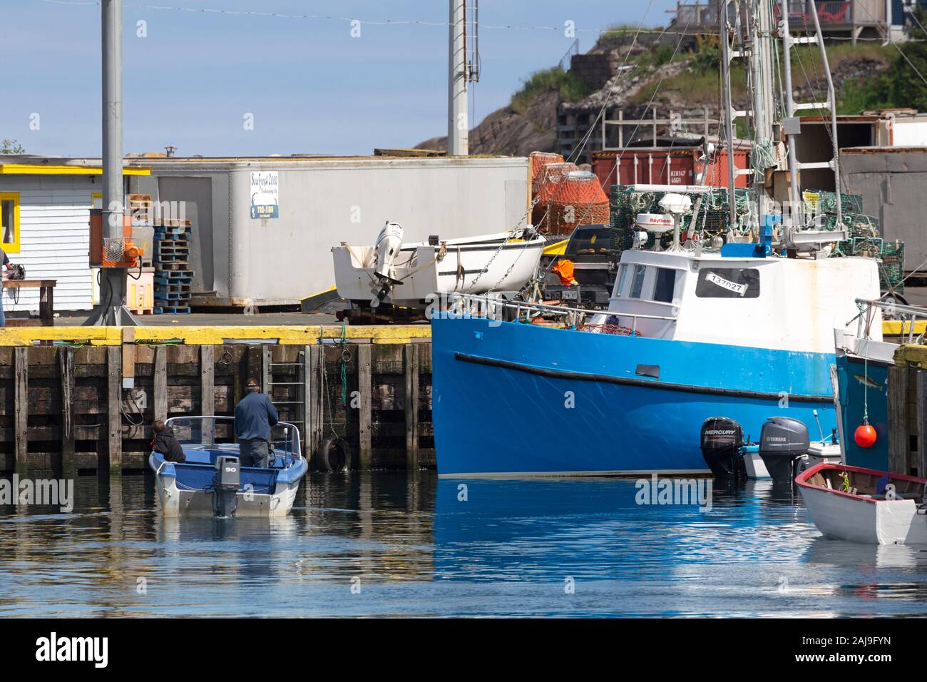 Fishing boat moored at St John's, Newfoundland and Labrador, Canada. The fishing industry was long a major source of local employment. Stock Photo