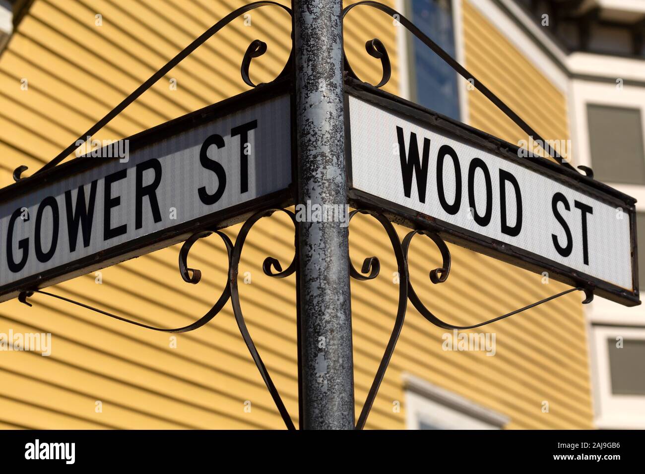 Sign for Gower Street and Wood Street in St John's, Newfoundland and Labrador, Canada. The sign is held by wrought iron. Stock Photo
