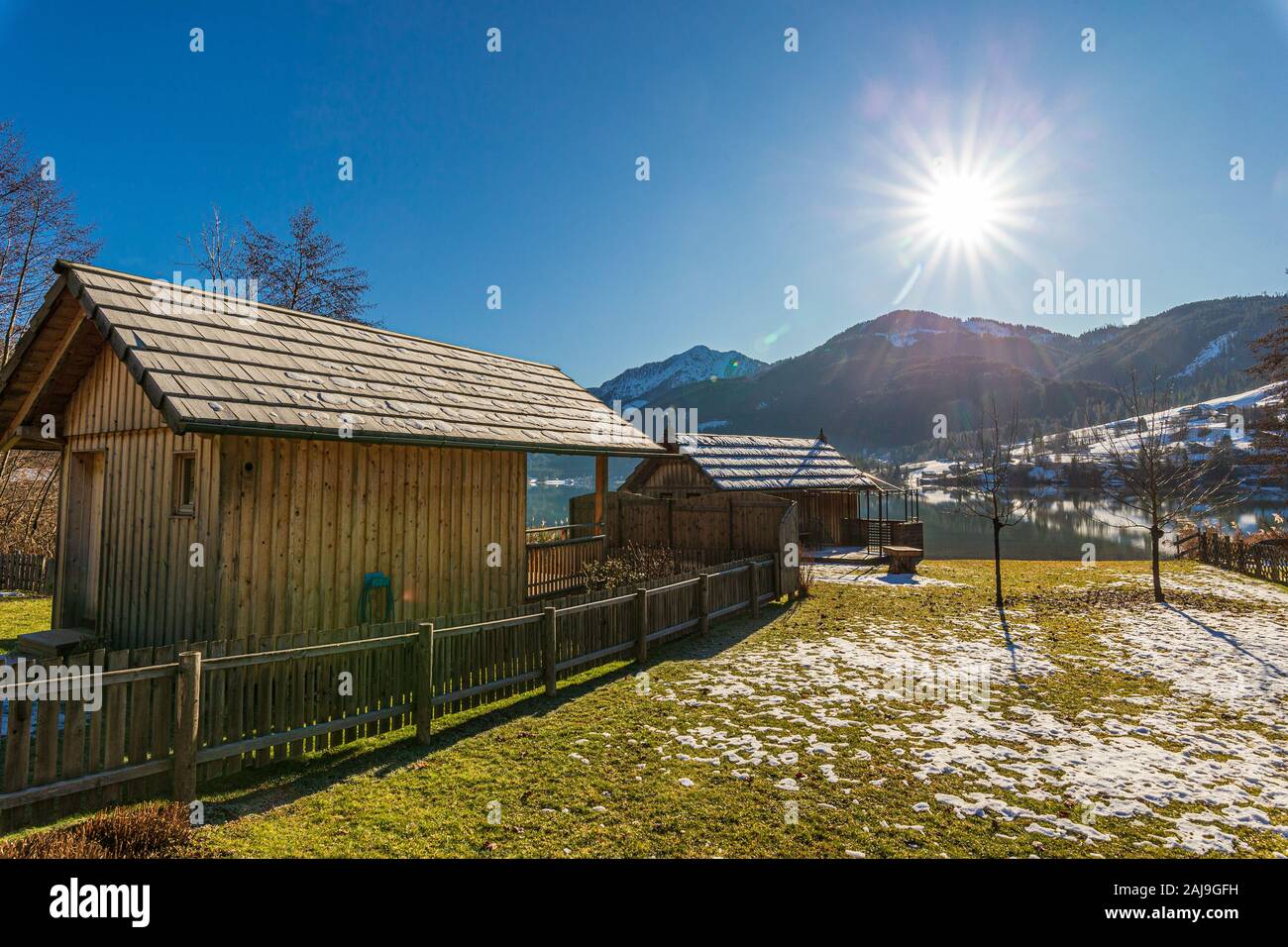 Old wooden boat house on shore of Weissensee lake, Austria Stock Photo