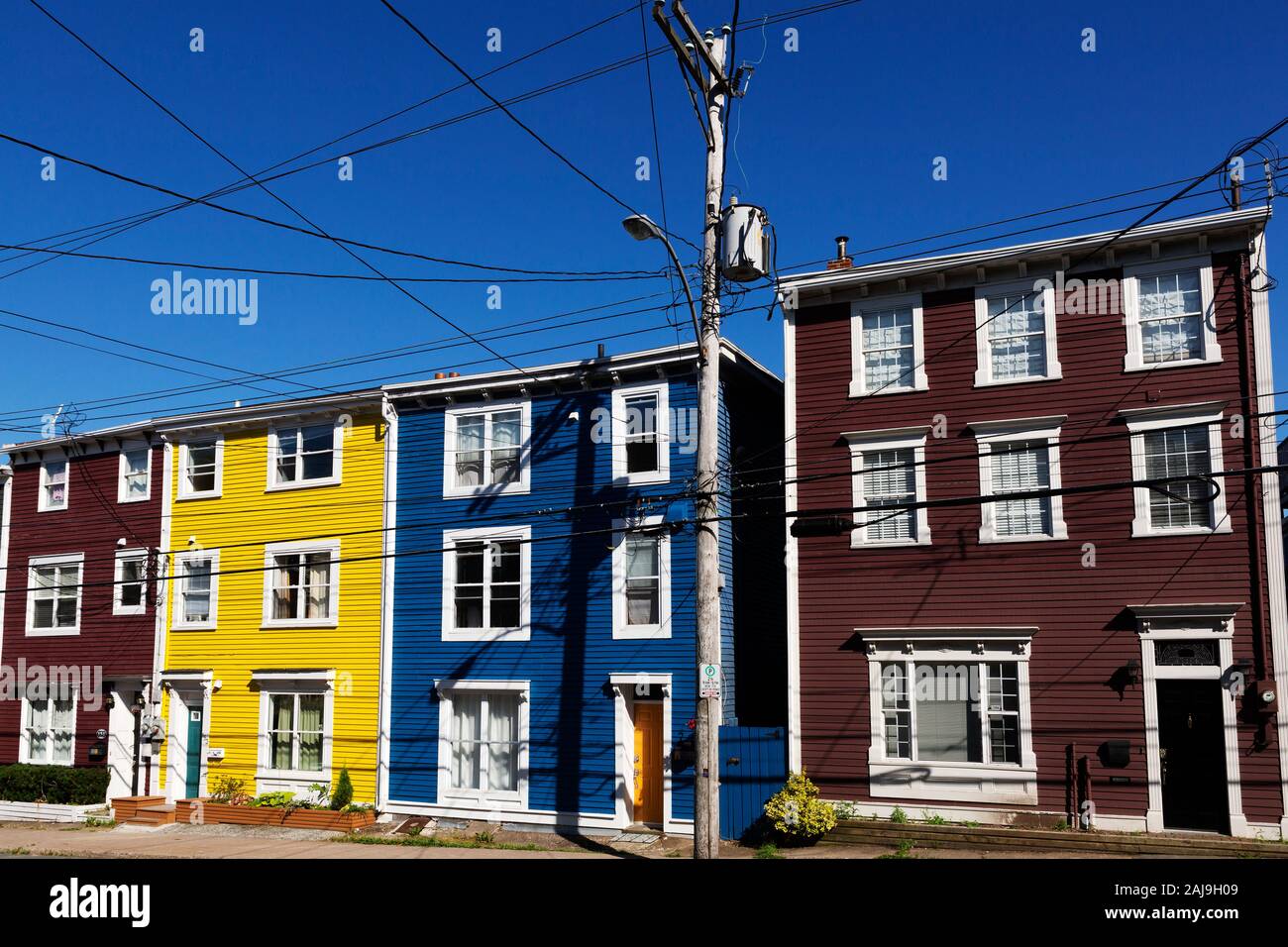 Colourful houses in St John's, Newfoundland and Labrador, Canada. Cables are suspended above the