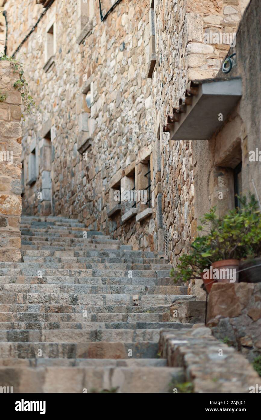 Stone steps up on a narrow street in an old European city in Spain