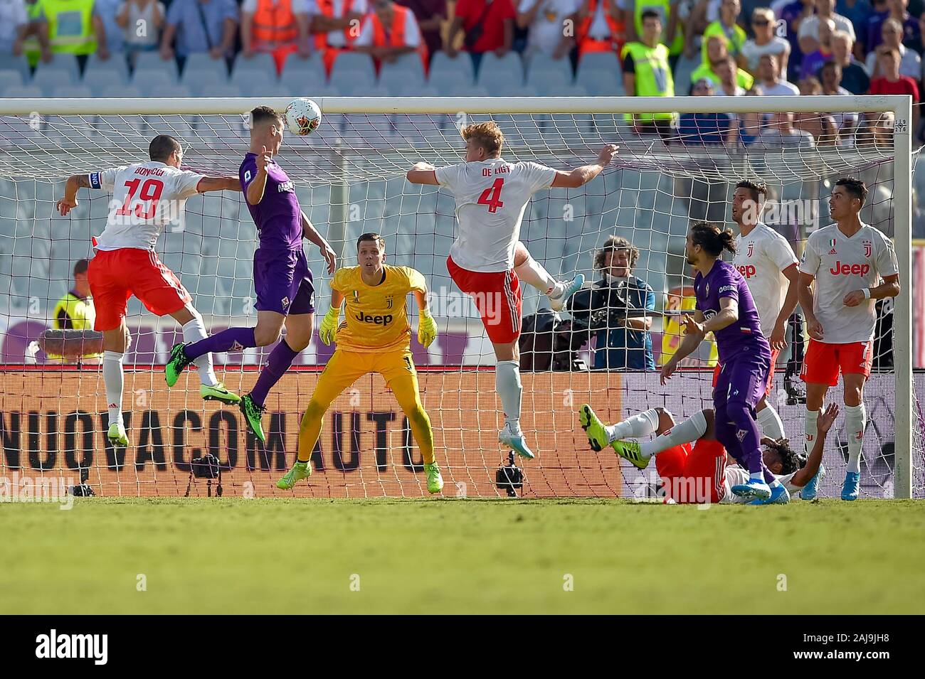 Florence, Italy. 14 September, 2019: Nikola Milenkovic (C) of ACF Fiorentina competes for a header with Leonardo Bonucci (L) and Matthijs de Ligt of Juventus FC during the Serie A football match between ACF Fiorentina and Juventus FC. The match ended in a 0-0 tie. Credit: Nicolò Campo/Alamy Live News Stock Photo