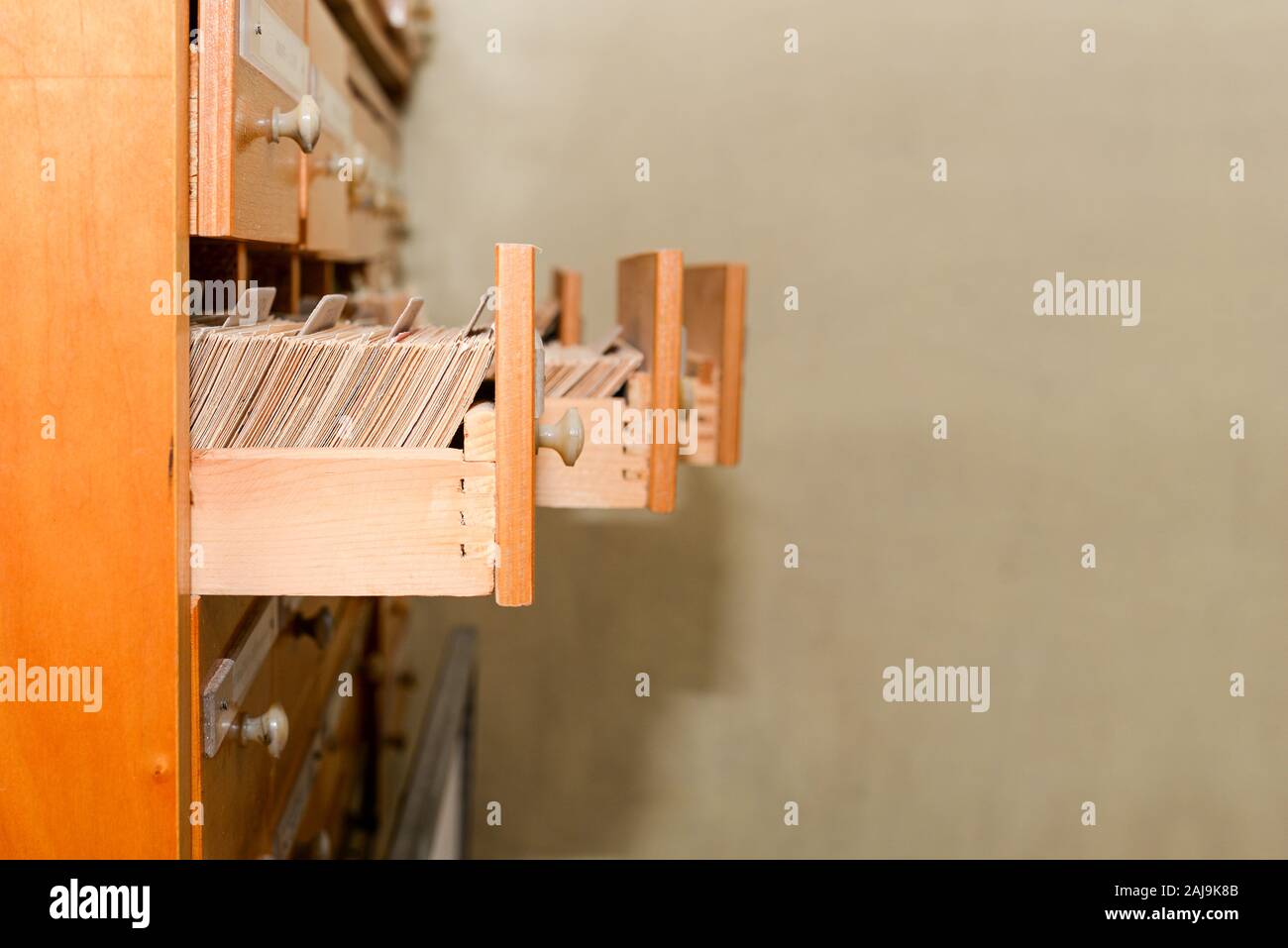 Opened wooden drawers in the library. Getting knowledge and background information. Database Stock Photo