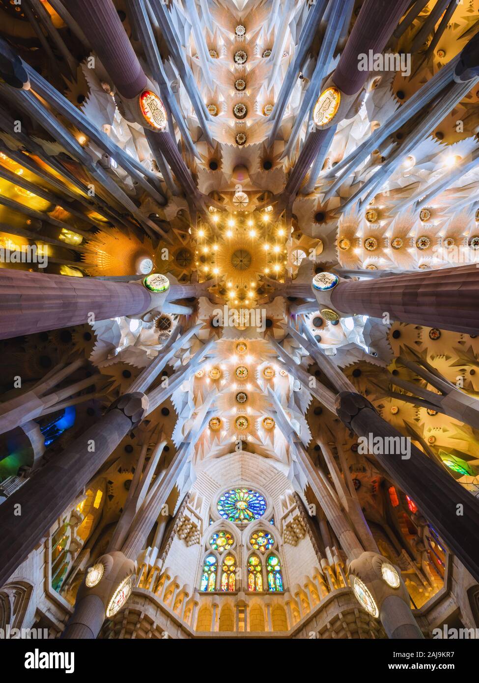 Interiors of architectural landmark La Sagrada Familia cathedral, designed by Catalan architect Antoni Gaudi in Barcelona, Spain. Stock Photo