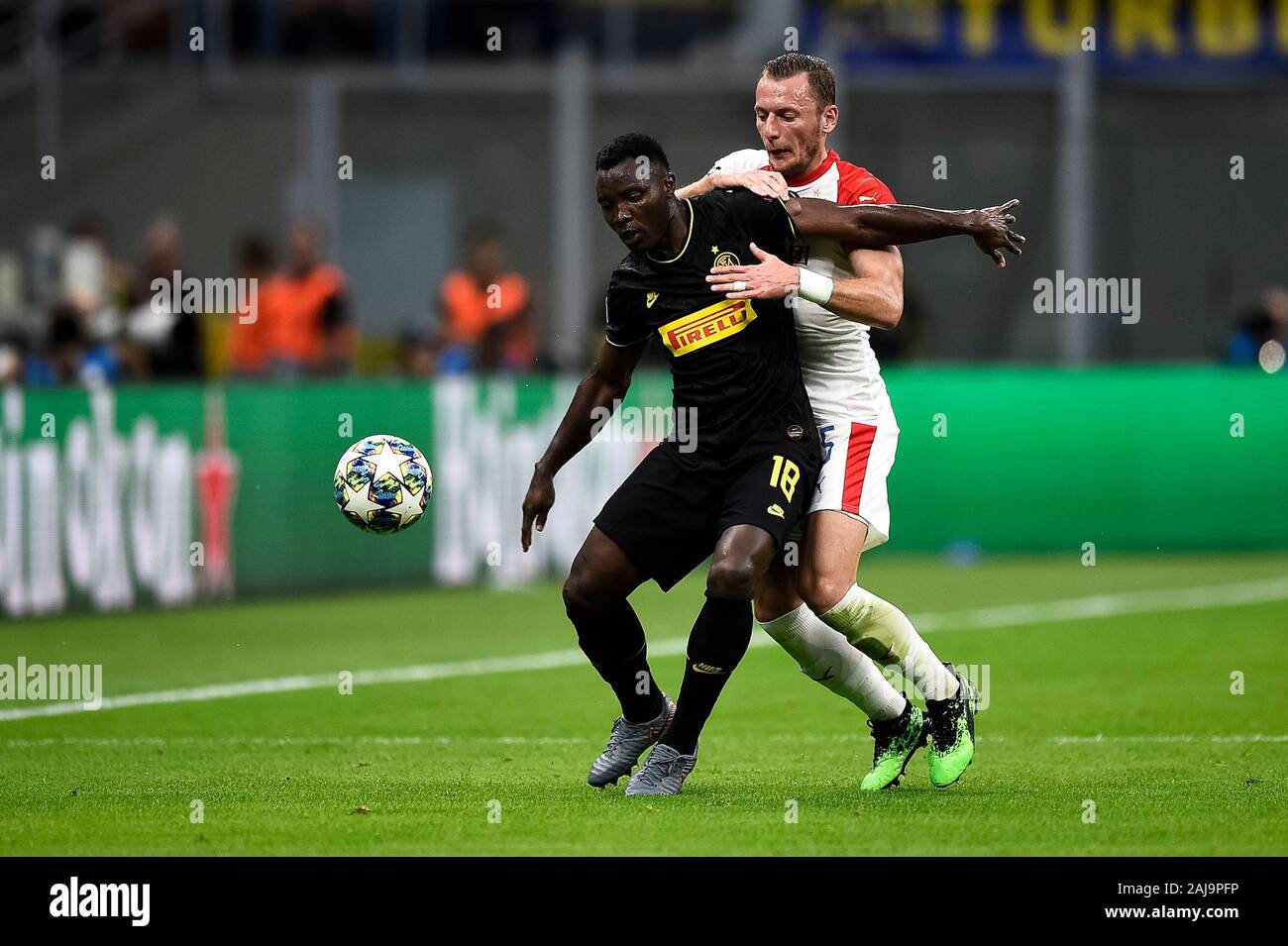Milan, Italy. 17 September, 2019: Kwadwo Asamoah (L) of FC Internazionale competes for the ball with Vladimir Coufal of SK Slavia Praha during the UEFA Champions League football match between FC Internazionale and SK Slavia Praha. The match ended in a 1-1 tie. Credit: Nicolò Campo/Alamy Live News Stock Photo