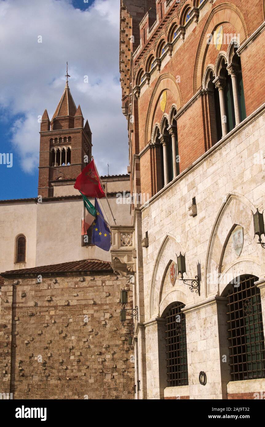 Palazzo Aldobrandeschi (Palazzo della Provincia) and the cathedral bell tower in the background, Grosseto, Tuscany, Italy Stock Photo