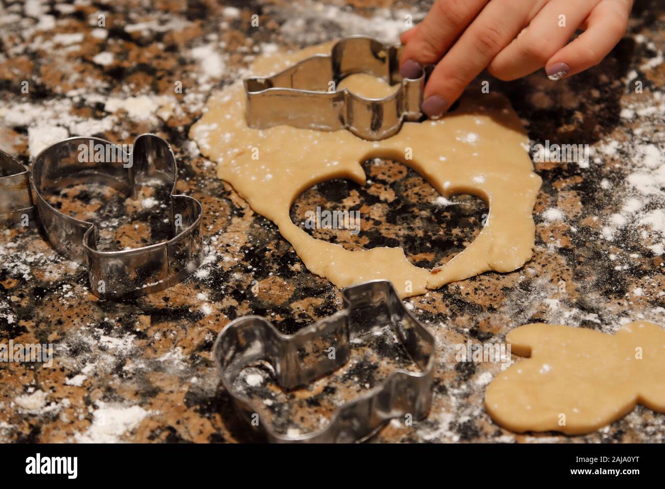 Cookie cutter making sugar cookies Stock Photo Alamy