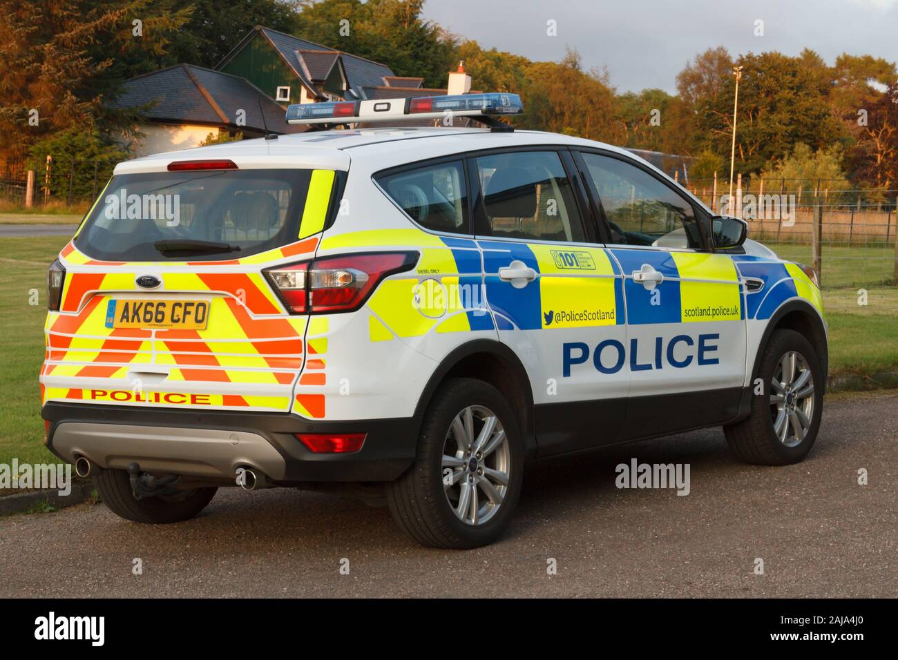 Police patrol vehicle parked on rural road on the Isle of Mull Scotland Stock Photo
