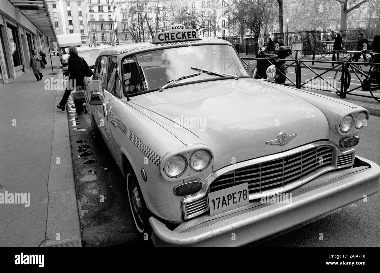 NEW YORK CAB IN PARIS STREET - CHECKER MOTORS CORPORATION - ICONIC AMERICAN TAXI - CHECKER CAB - PARIS CAR - STREET CAR PHOTOGRAPHY - SILVER IMAGE © Frédéric BEAUMONT Stock Photo