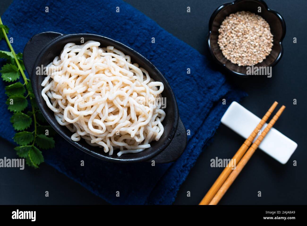 Healthy food concept organic Noodle or spaghetti Shirataki Konjac in black ceramic cup with copy space Stock Photo