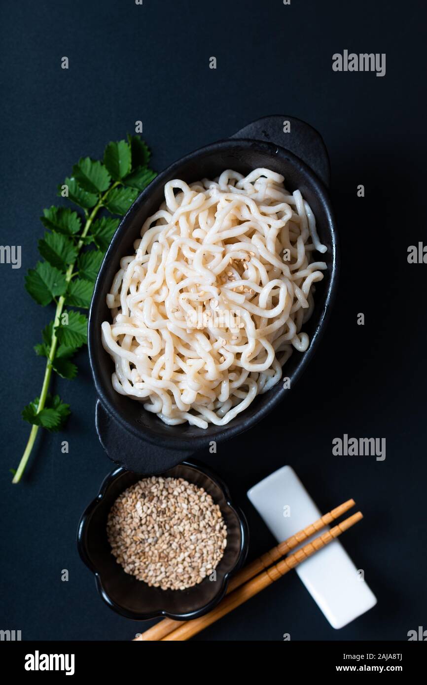 Healthy food concept organic Noodle or spaghetti Shirataki Konjac in black ceramic cup with copy space Stock Photo