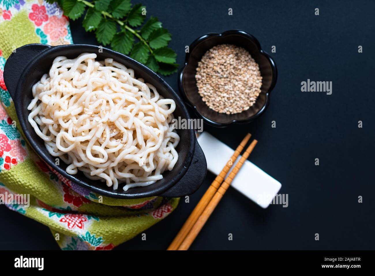 Healthy food concept organic Noodle or spaghetti Shirataki Konjac in black ceramic cup with copy space Stock Photo