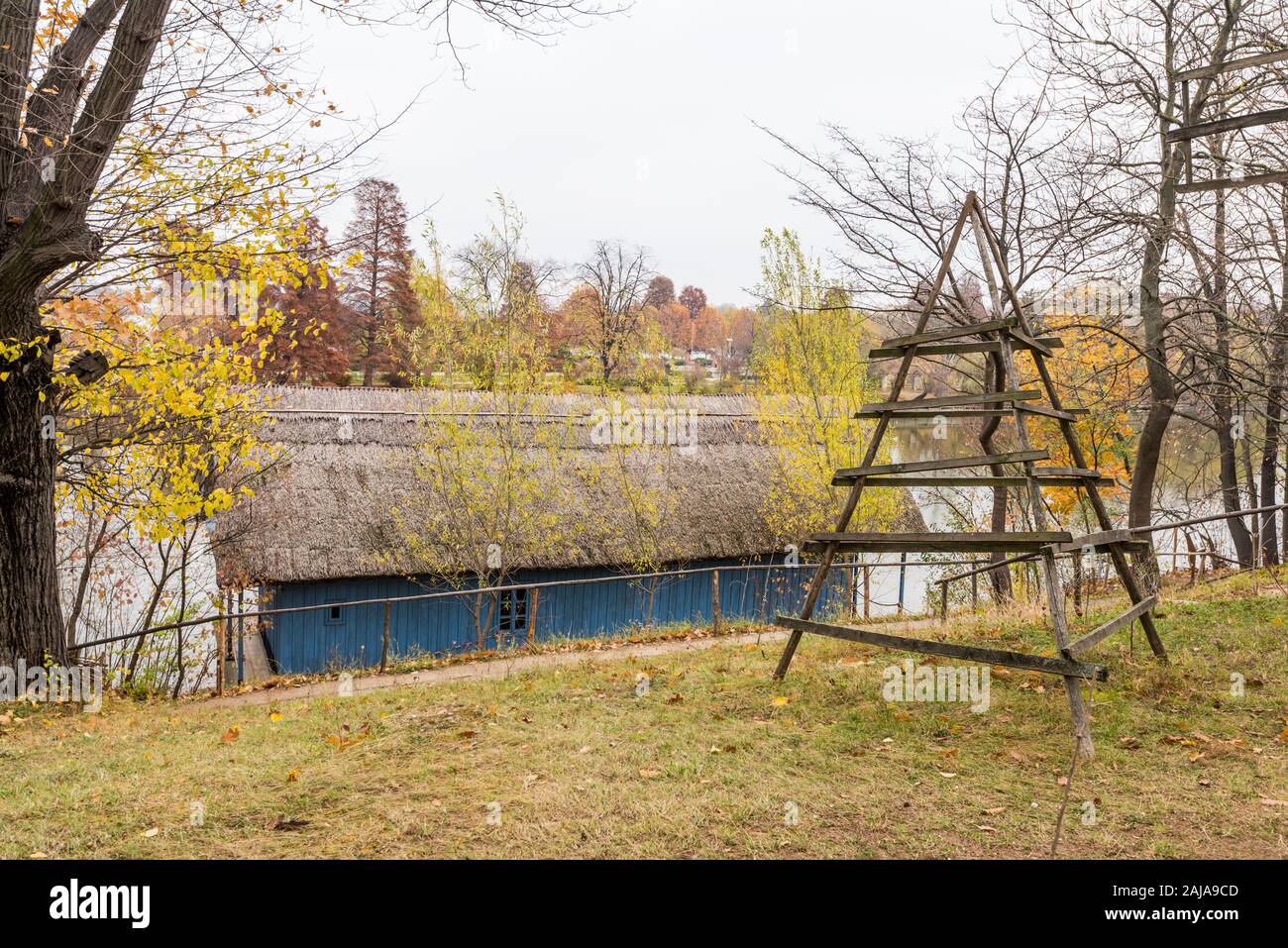 Authentic peasant houses from all over Romania in Dimitrie Gusti National Village Museum at the lakeshore of herastrau lake, located in the King Micha Stock Photo