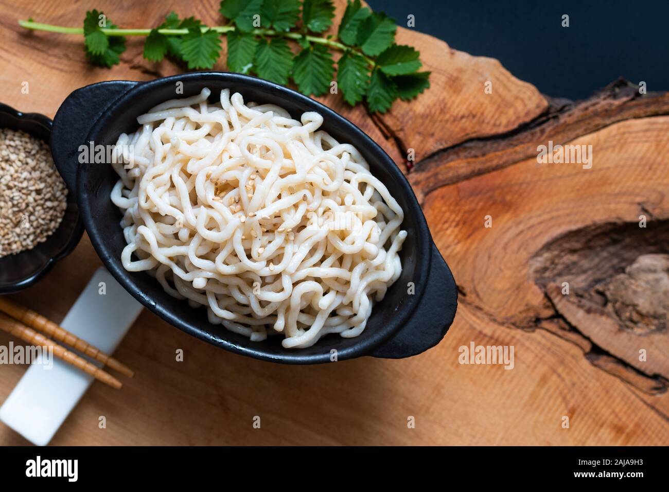 Healthy food concept organic Noodle or spaghetti Shirataki Konjac in black ceramic cup with copy space Stock Photo