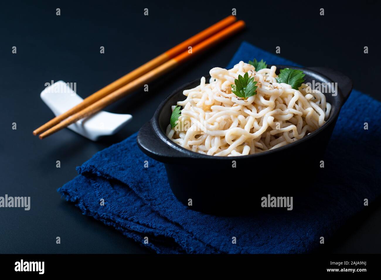 Healthy food concept organic Noodle or spaghetti Shirataki Konjac in black ceramic cup with copy space Stock Photo
