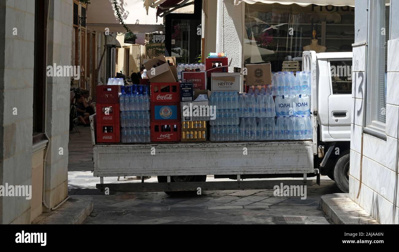 Water being delivered to a cafe in Syros, Greece. Stock Photo