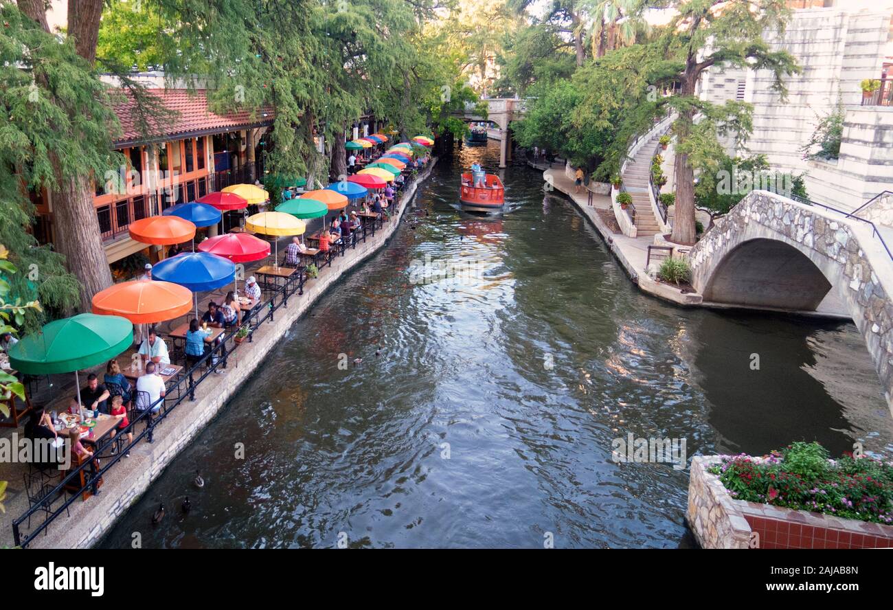 Restraunt with umbrellas on  Reverwalk, San Antonio, Texas; Multiple image merger Stock Photo