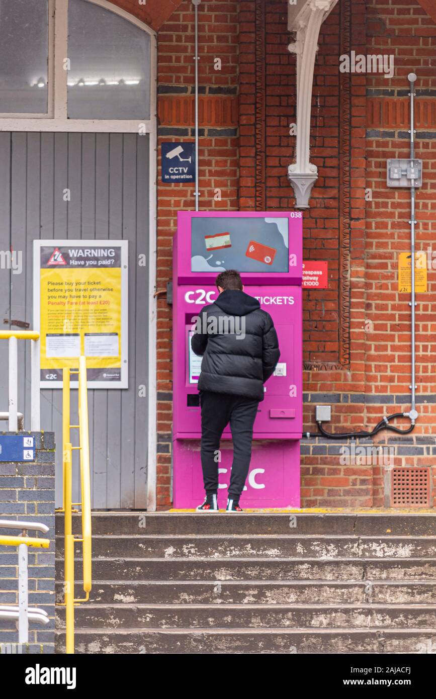 New ticket machine outside Trenitalia C2C Southend Central railway station in Southend on Sea, Essex, UK. Passenger using machine. Problematic system Stock Photo