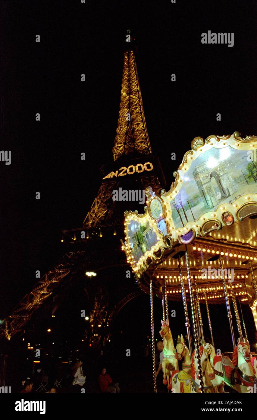 PARIS EIFFEL TOWER AT NIGHT WITH THE 2000 GIANT NEW-YEAR LETTERS WRITEN ON THE FIRST FLOOR -  PARIS CAROUSSEL - PARIS NIGHT STREET PHOTOGRAPHY - COLOR SILVER FILM © Frédéric BEAUMONT Stock Photo