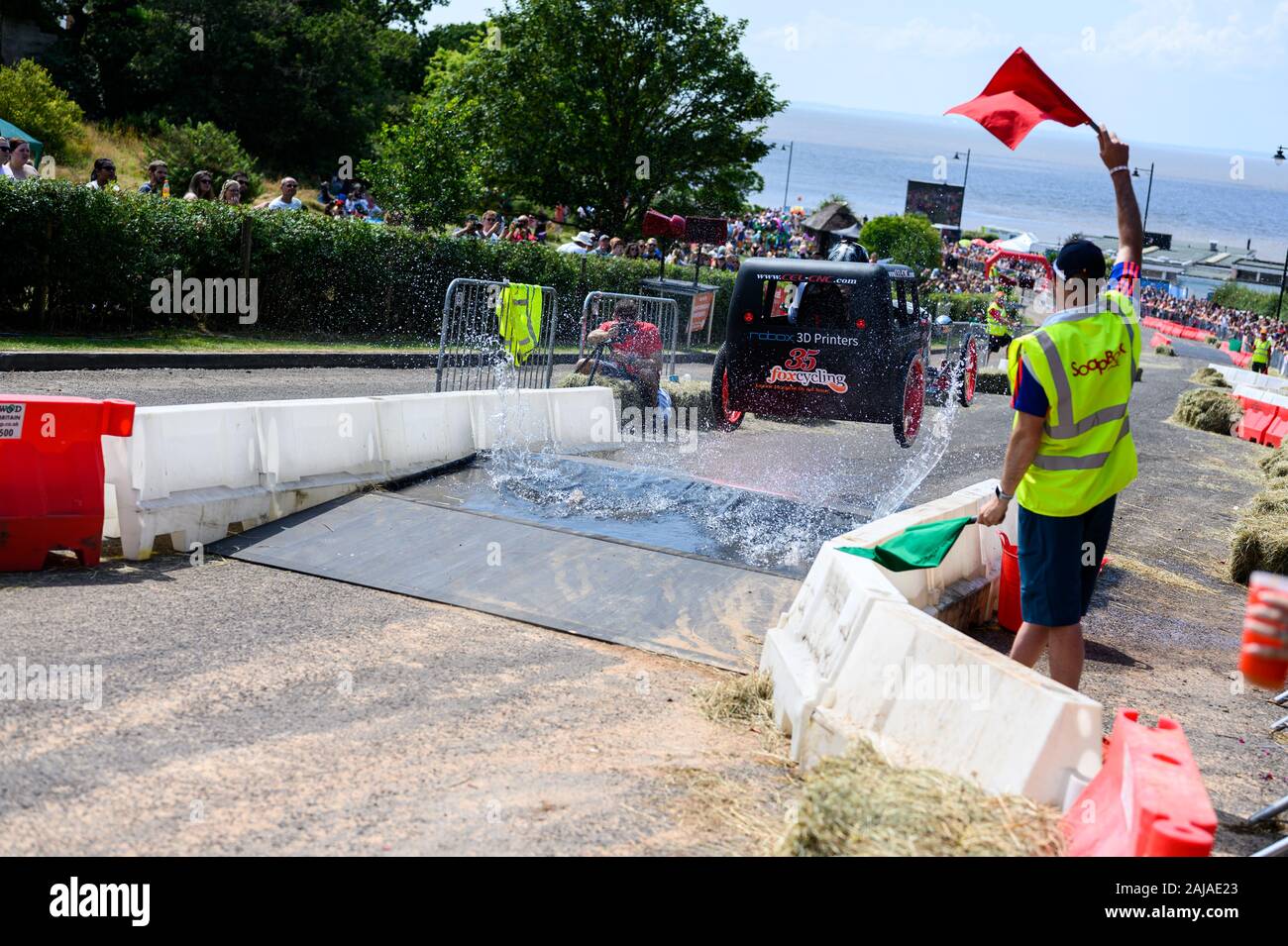 Car jumps over ramp in Portishead Soapbox Race 2019 Stock Photo
